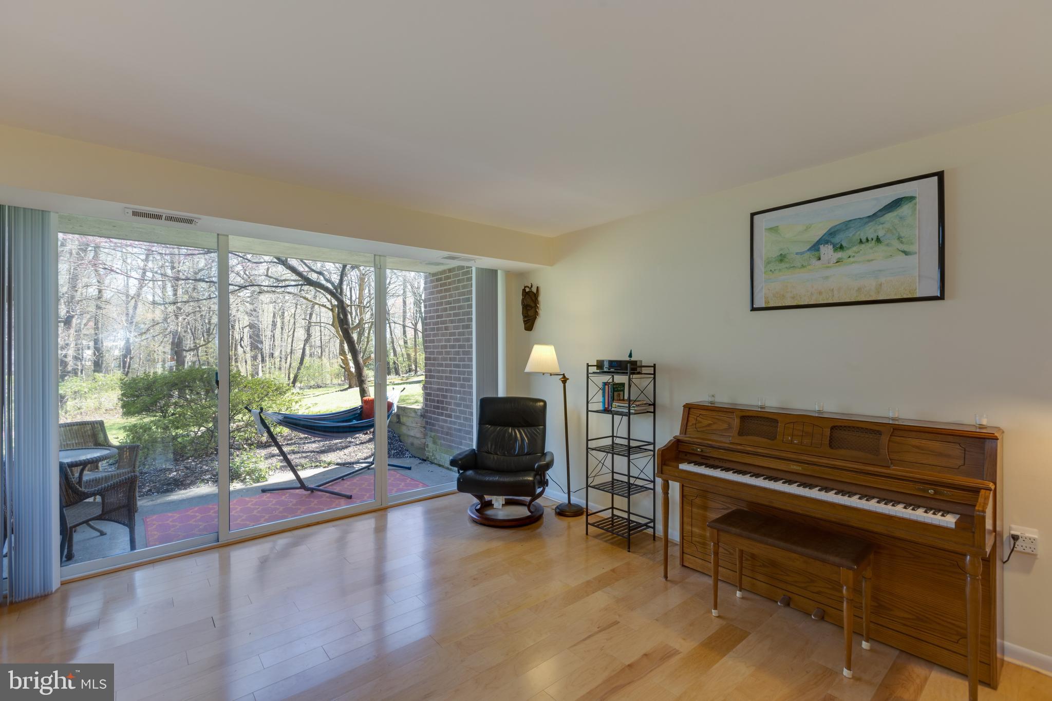 1427 Northgate Square, Unit 2A Reston, VA 20190 - Photo 4 of 50 Living Room opens to patio and greenspace