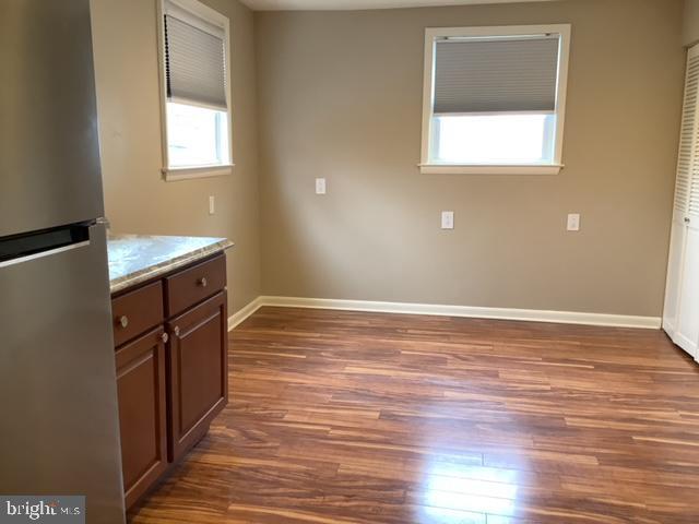 14 Broad Street, Unit 2 Florence, NJ 08518 - Photo 2 of 13 a room with wooden floors and window