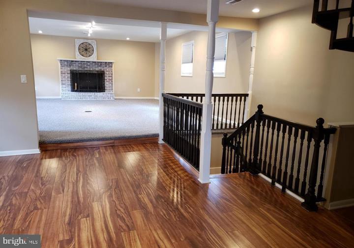 14 Broad Street, Unit 2 Florence, NJ 08518 - Photo 4 of 13 wooden floor in an empty room with a fireplace