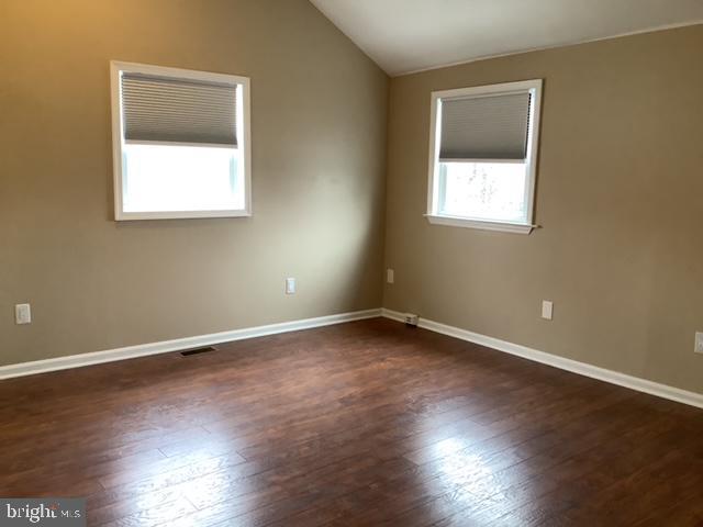 14 Broad Street, Unit 2 Florence, NJ 08518 - Photo 8 of 13 an empty room with wooden floor and windows
