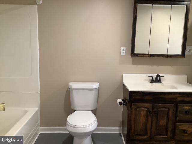 14 Broad Street, Unit 2 Florence, NJ 08518 - Photo 9 of 13 a bathroom with a sink a toilet and mirror