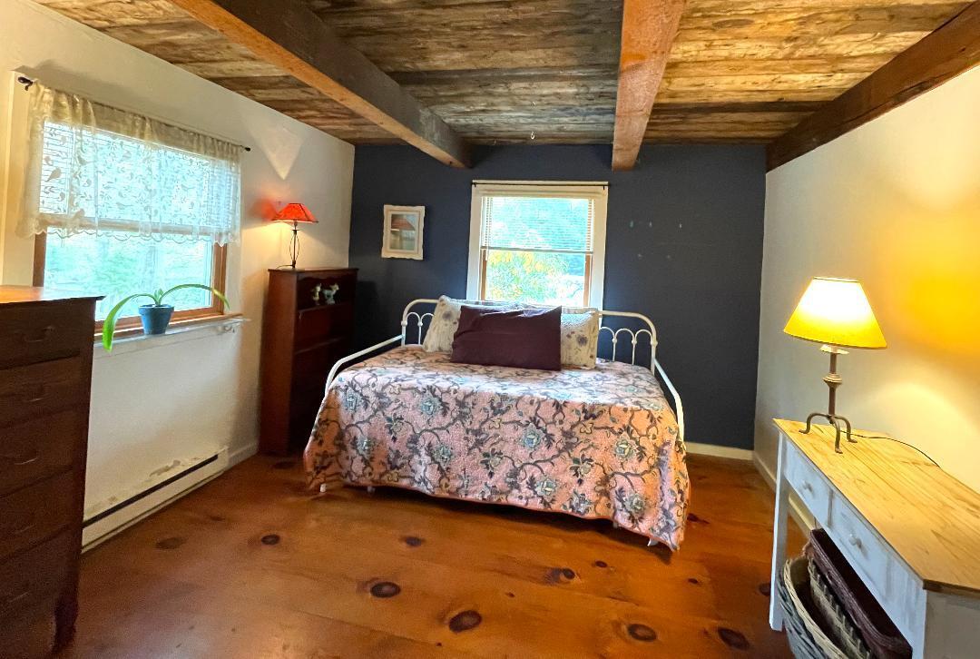 14 21st Street North Edgartown, MA 02539 - Photo 11 of 19 a bedroom with a bed dresser and a window