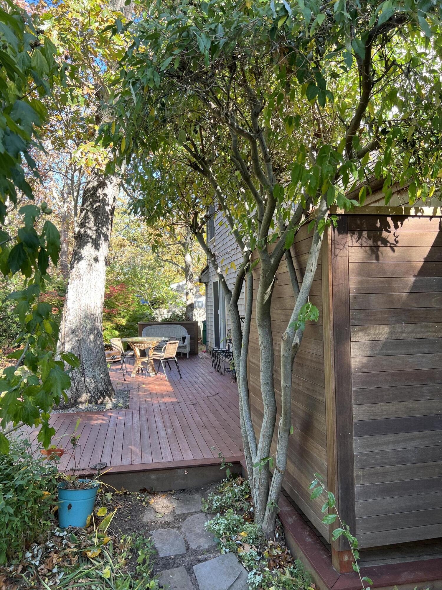 14 21st Street North Edgartown, MA 02539 - Photo 17 of 19 a view of backyard with table and chairs and a large tree