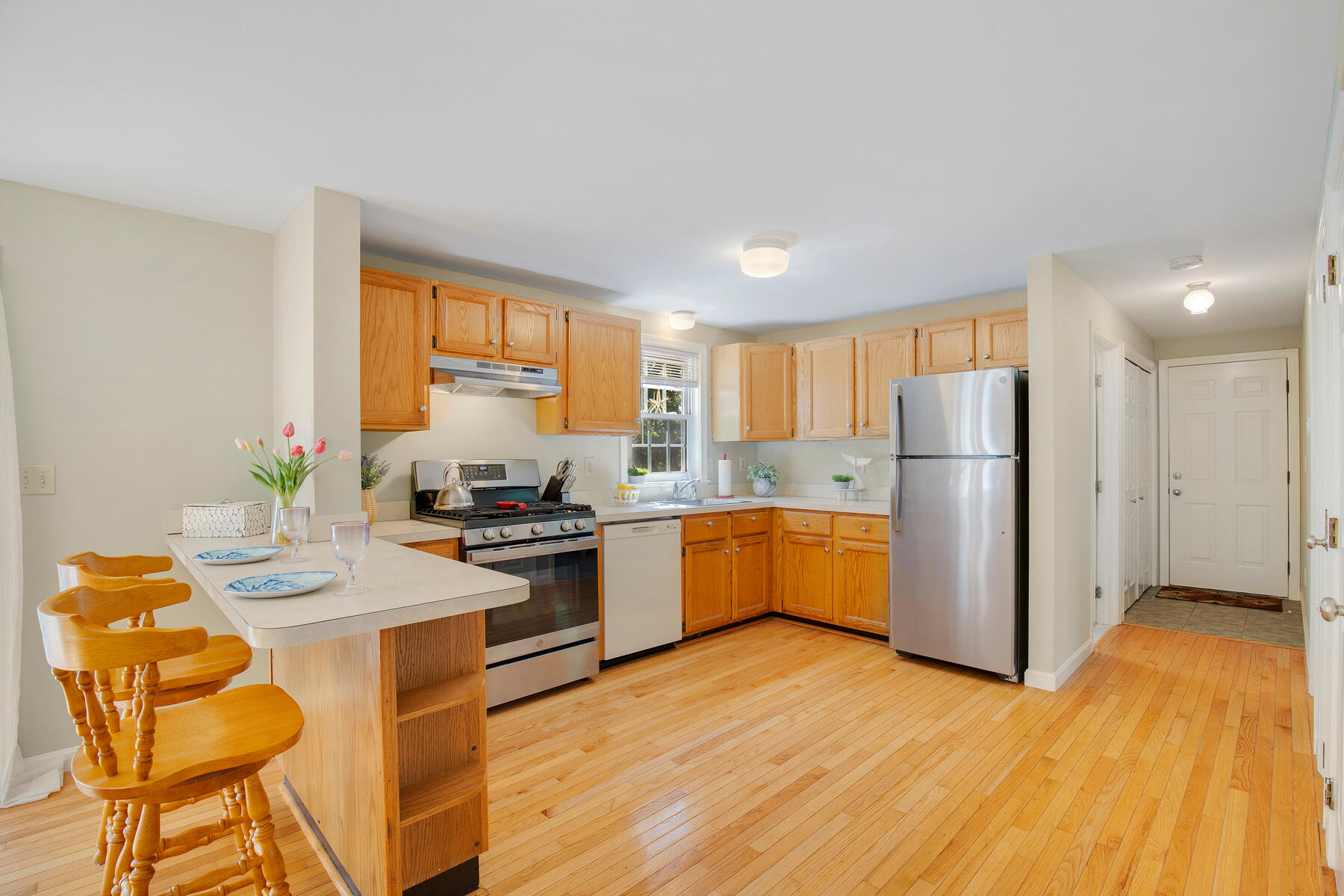 29 Carleton Drive Mashpee, MA 02649 - Photo 12 of 32 12 Kitchen with garage door at end of ha