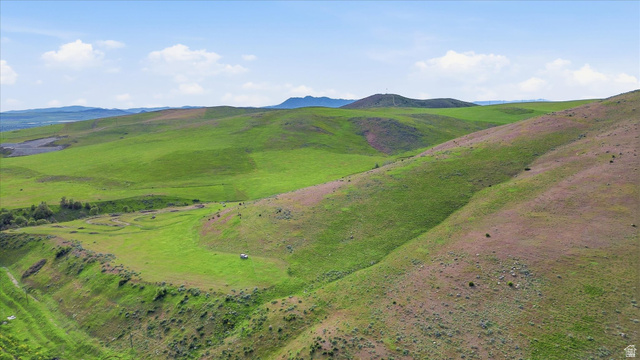 2075 Canyon Road Smithfield, UT 84335 - Photo 14 of 18 Expansive rolling hills with vibrant green and muted brown grasses