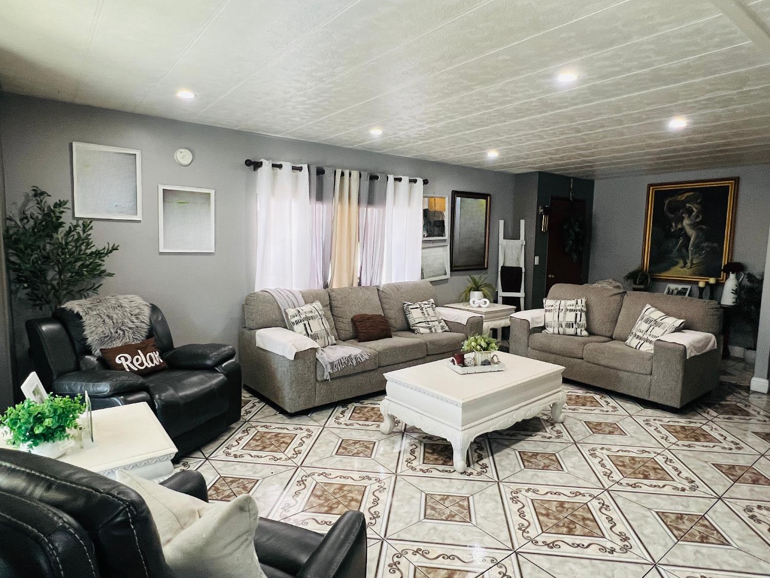 2845 East E Hatch Road, Unit 86 Ceres, CA 95351 - Photo 11 of 32 a living room with furniture and wooden floor