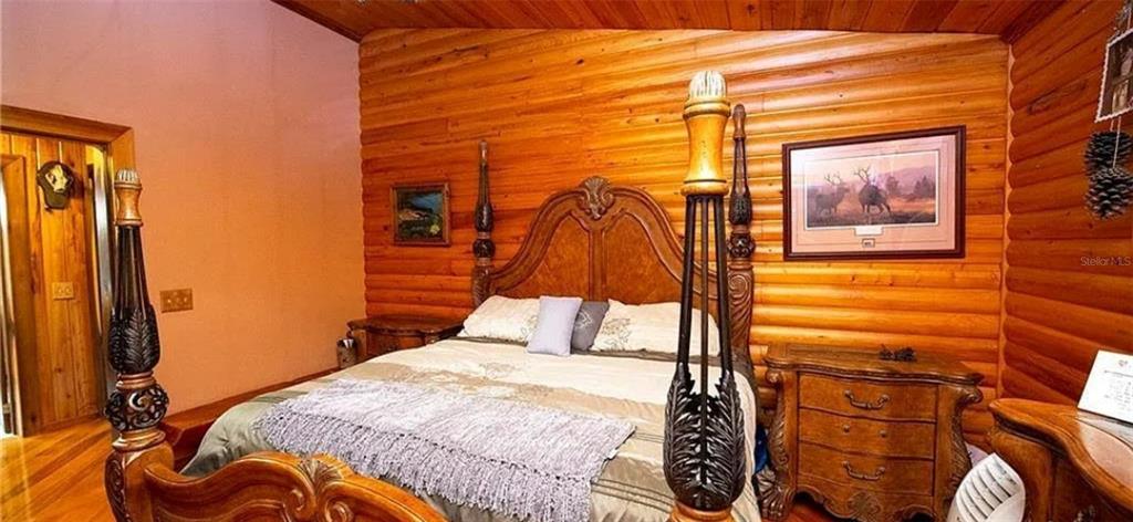 13255 Highway 441 Okeechobee, FL 34974 - Photo 17 of 29 a bedroom with a bed and a window