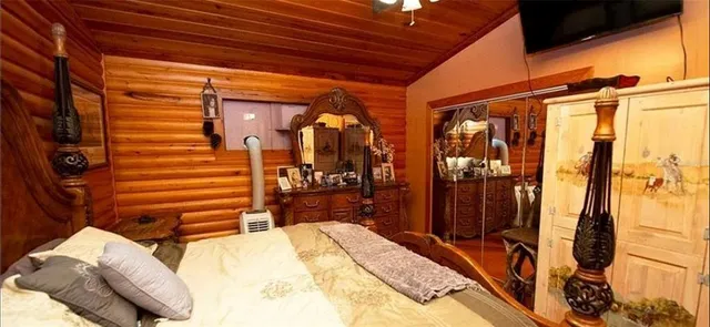 a white toilet sitting next to a bathroom sink and a shower