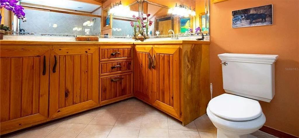 13255 Highway 441 Okeechobee, FL 34974 - Photo 20 of 29 a bathroom with a sink a toilet and shower