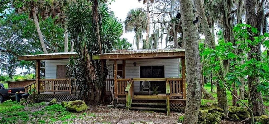 13255 Highway 441 Okeechobee, FL 34974 - Photo 23 of 29 a view of outdoor space deck and kitchen