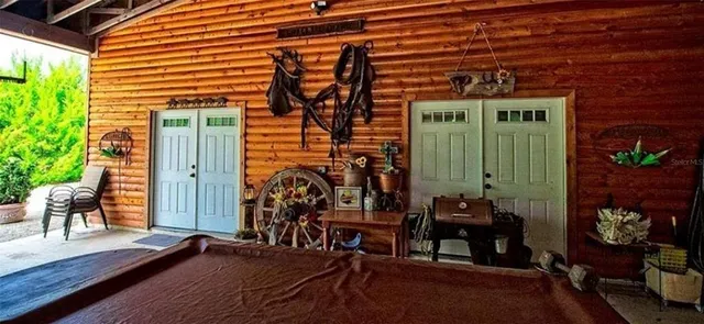 a front view of a house with outdoor seating