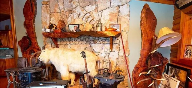 a kitchen with stainless steel appliances granite countertop a sink and wooden cabinets