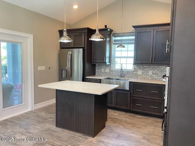 a stove top oven sitting inside of a kitchen