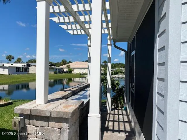 a view of a lake with a house in the background