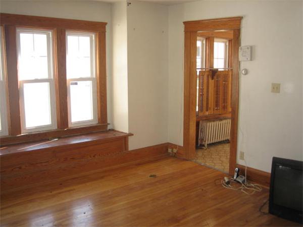 17 Tallawanda Drive Worcester, MA 01603 - Photo 4 of 20 an empty room with wooden floor and windows