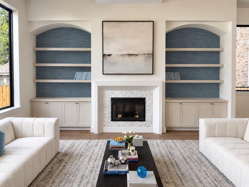 2325 Wroxton Road Houston, TX 77005 - Photo 11 of 34 Custom build ins in the living room lined with grasscloth wallpaper, custom plastered mantle and marble surround