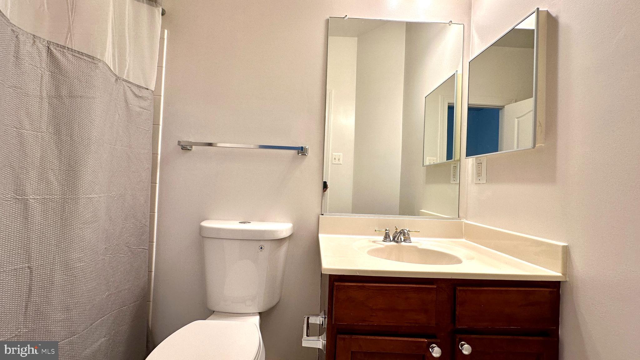 14020 Castle Ridge Way, Unit 38 Silver Spring, MD 20904 - Photo 20 of 30 a bathroom with a sink toilet and mirror