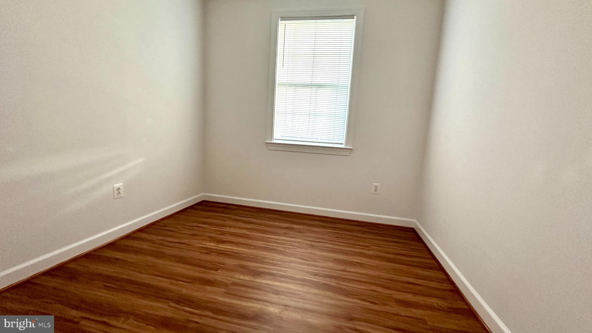 14020 Castle Ridge Way, Unit 38 Silver Spring, MD 20904 - Photo 21 of 30 a view of a room with wooden floor and white walls