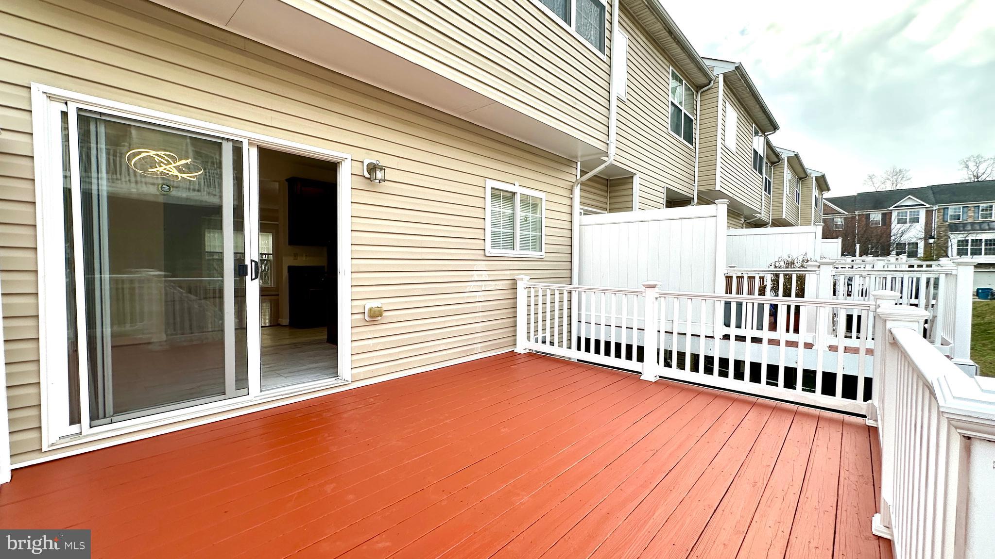 14020 Castle Ridge Way, Unit 38 Silver Spring, MD 20904 - Photo 26 of 30 a view of backyard with deck and wooden floor