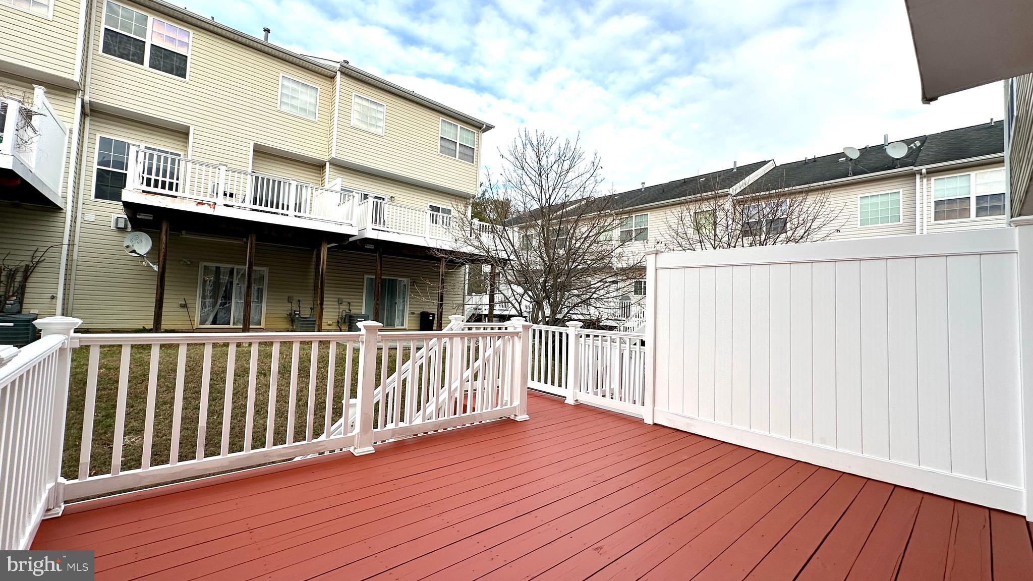 14020 Castle Ridge Way, Unit 38 Silver Spring, MD 20904 - Photo 27 of 30 a view of a house with wooden deck