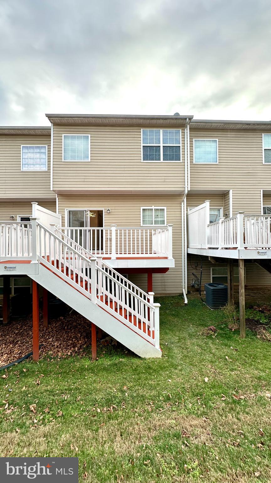 14020 Castle Ridge Way, Unit 38 Silver Spring, MD 20904 - Photo 29 of 30 a view of an house with backyard porch and furniture