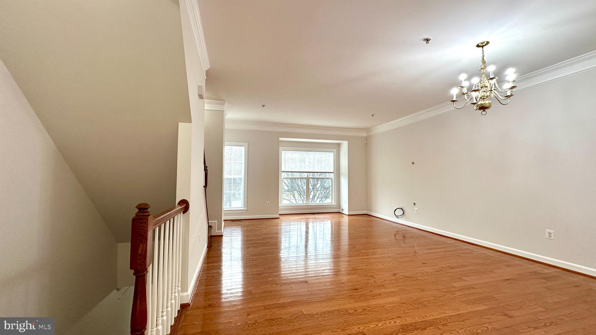 14020 Castle Ridge Way, Unit 38 Silver Spring, MD 20904 - Photo 4 of 30 wooden floor in an empty room with a window