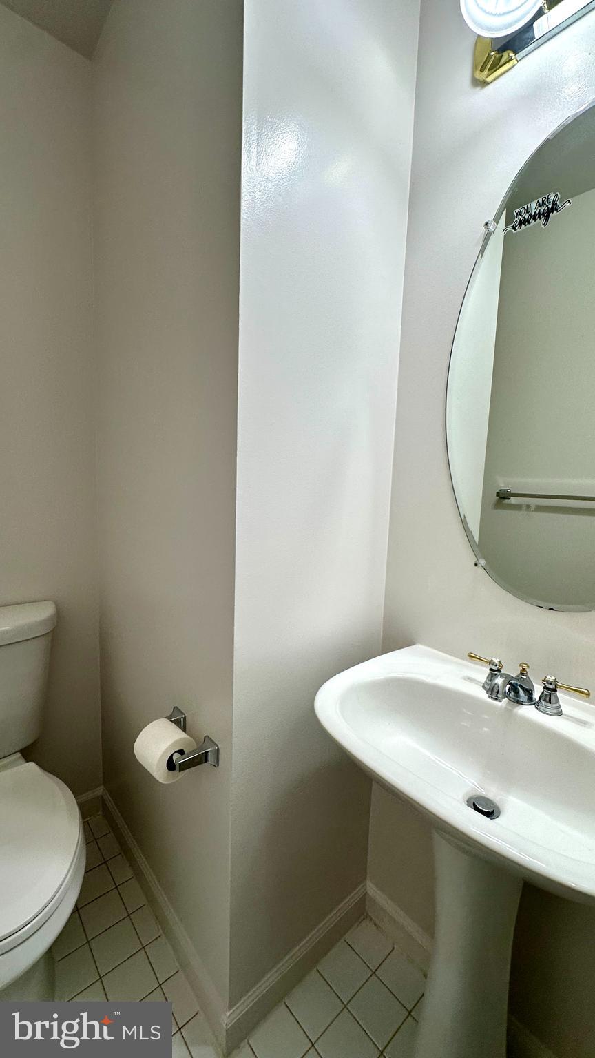 14020 Castle Ridge Way, Unit 38 Silver Spring, MD 20904 - Photo 7 of 30 a bathroom with a sink and a mirror