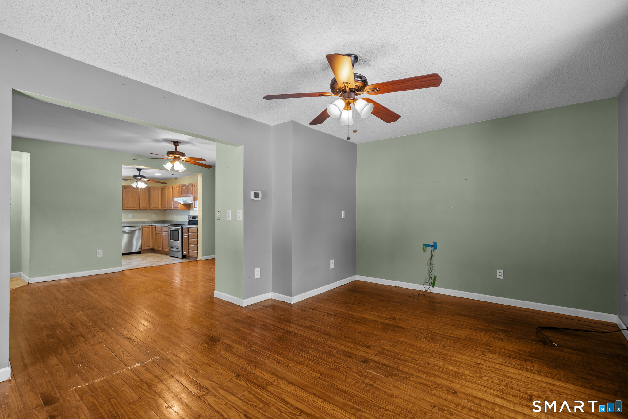 30 Ruth Street Norwich, CT 06360 - Photo 12 of 40 a view of a room with wooden floor and ceiling fan