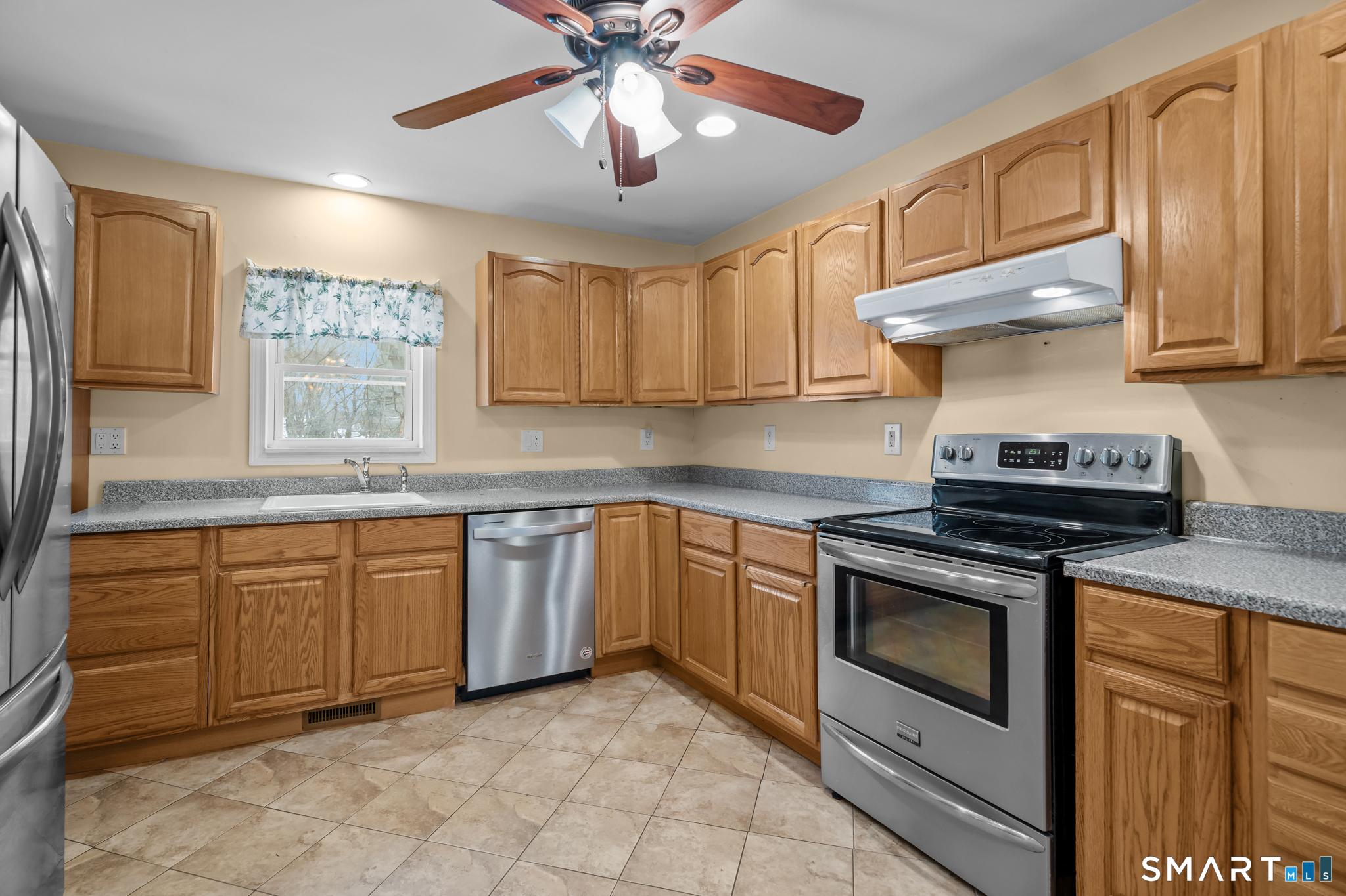 30 Ruth Street Norwich, CT 06360 - Photo 17 of 40 a kitchen with stainless steel appliances granite countertop a stove sink and cabinets