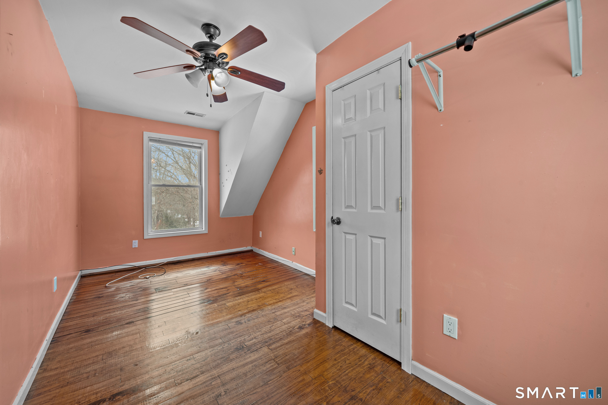 30 Ruth Street Norwich, CT 06360 - Photo 23 of 40 a view of an empty room with a window and wooden floor