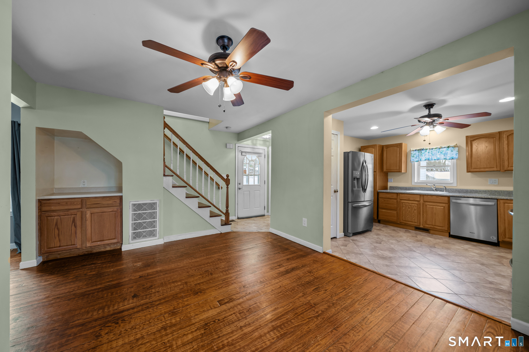 30 Ruth Street Norwich, CT 06360 - Photo 9 of 40 a view of a kitchen with a sink cabinets and wooden floor