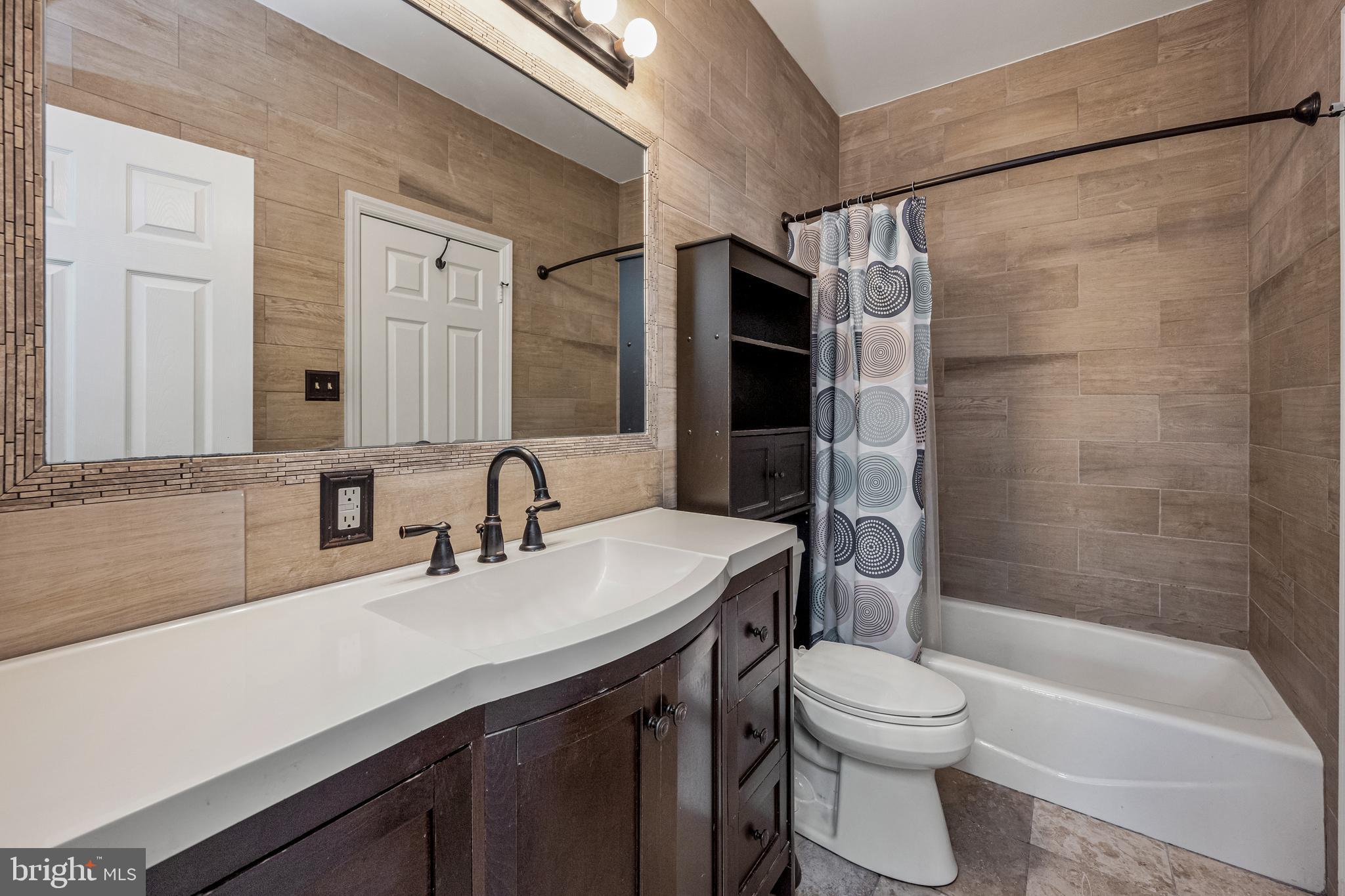 604 Moonglow Road, Unit 103 Odenton, MD 21113 - Photo 7 of 20 Updated primary bathroom.