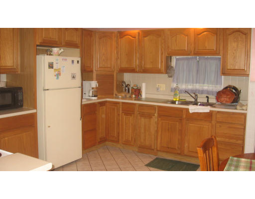 53 Vincent Street Springfield, MA 01129 - Photo 3 of 10 a kitchen with a refrigerator and a sink