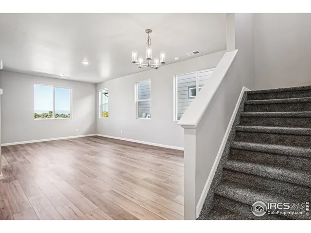 a kitchen that has a sink a stove and cabinets