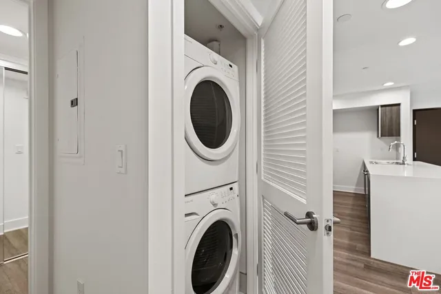 a view of a hallway with washer and dryer