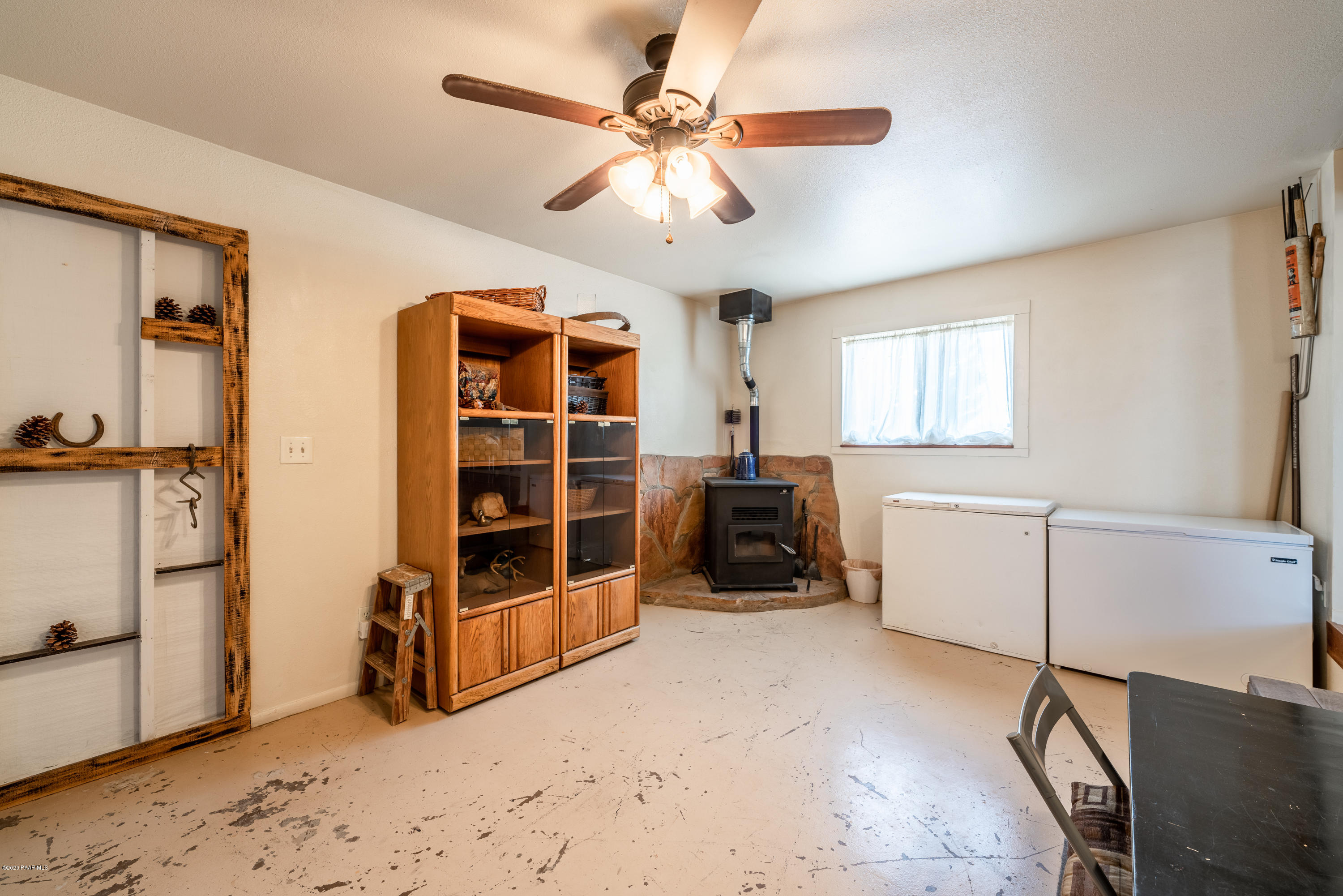 700 Ranch House Road Paulden, AZ 86334 - Photo 12 of 26 a view of a livingroom with furniture and a window