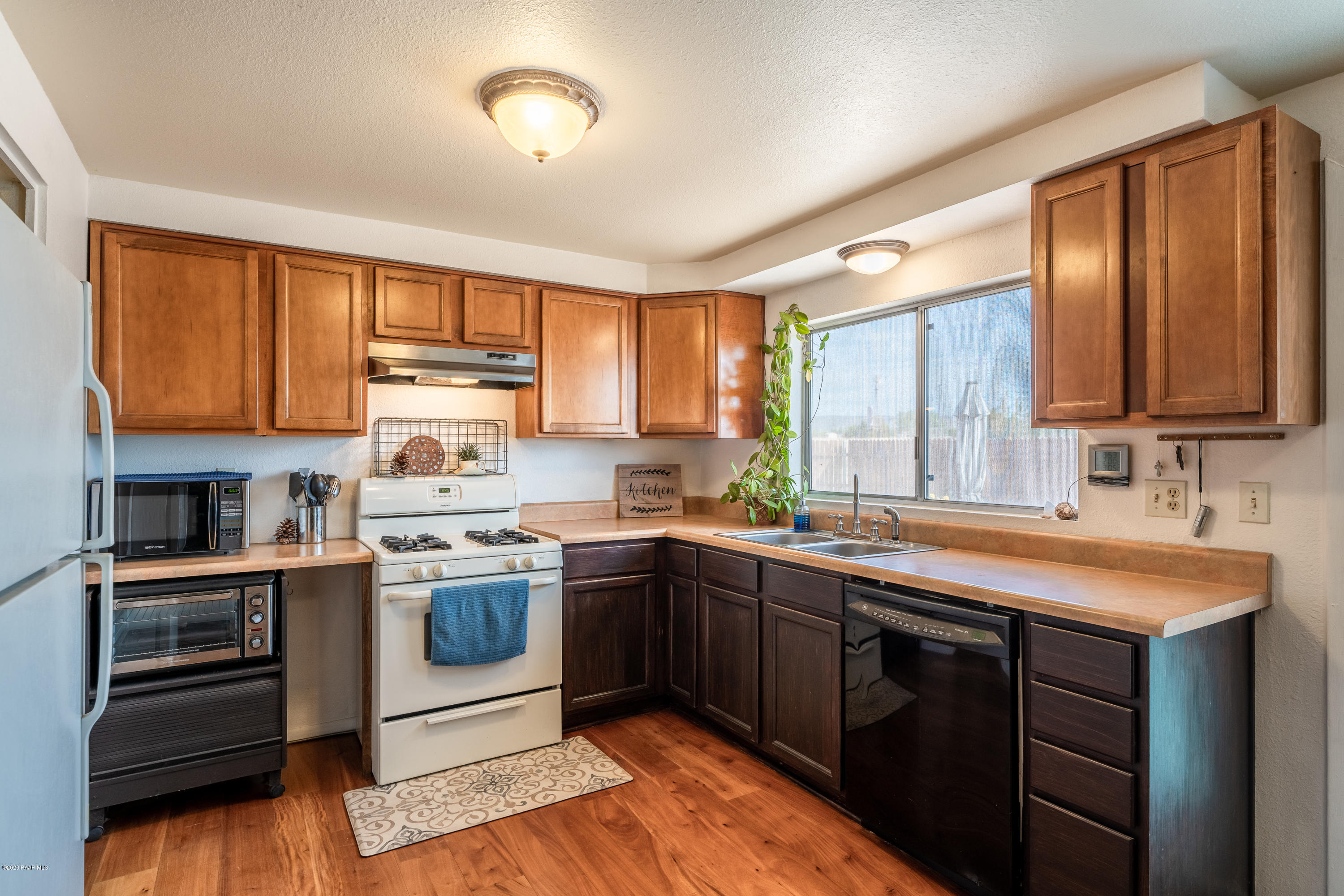 700 Ranch House Road Paulden, AZ 86334 - Photo 13 of 26 a kitchen with stainless steel appliances granite countertop a sink stove and refrigerator