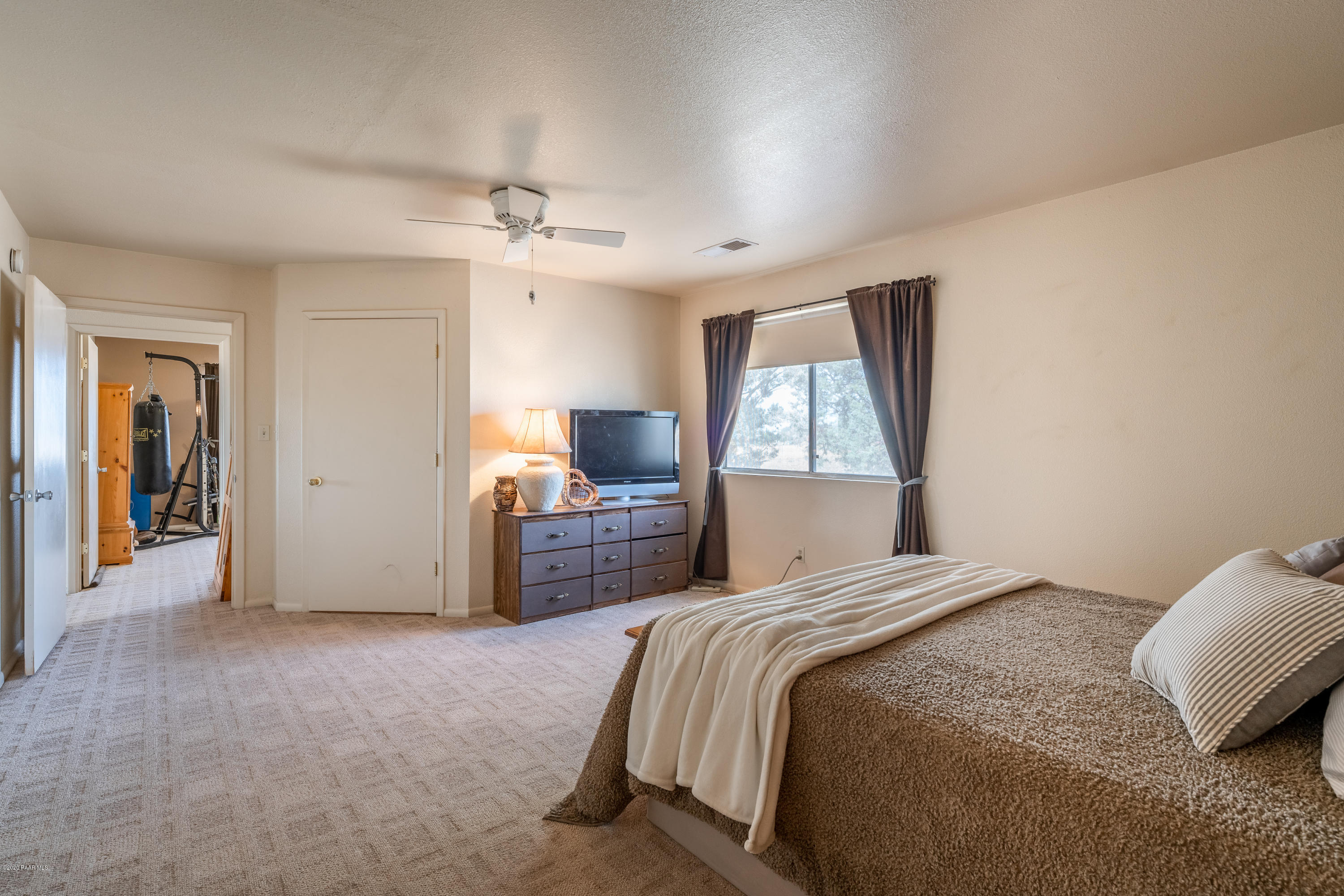 700 Ranch House Road Paulden, AZ 86334 - Photo 16 of 26 a bedroom with a bed closet and a window