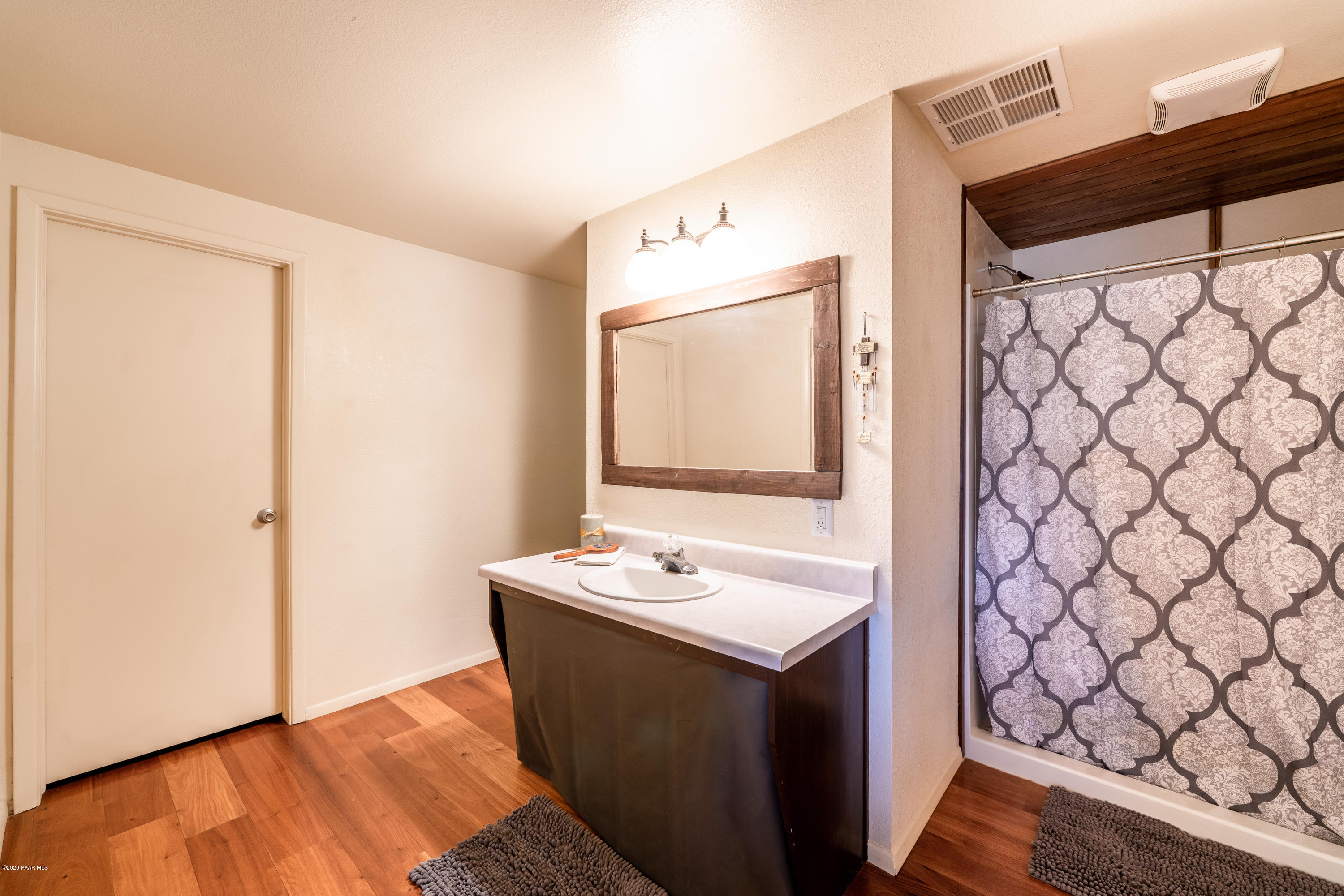 700 Ranch House Road Paulden, AZ 86334 - Photo 17 of 26 a bathroom with a sink vanity and a mirror