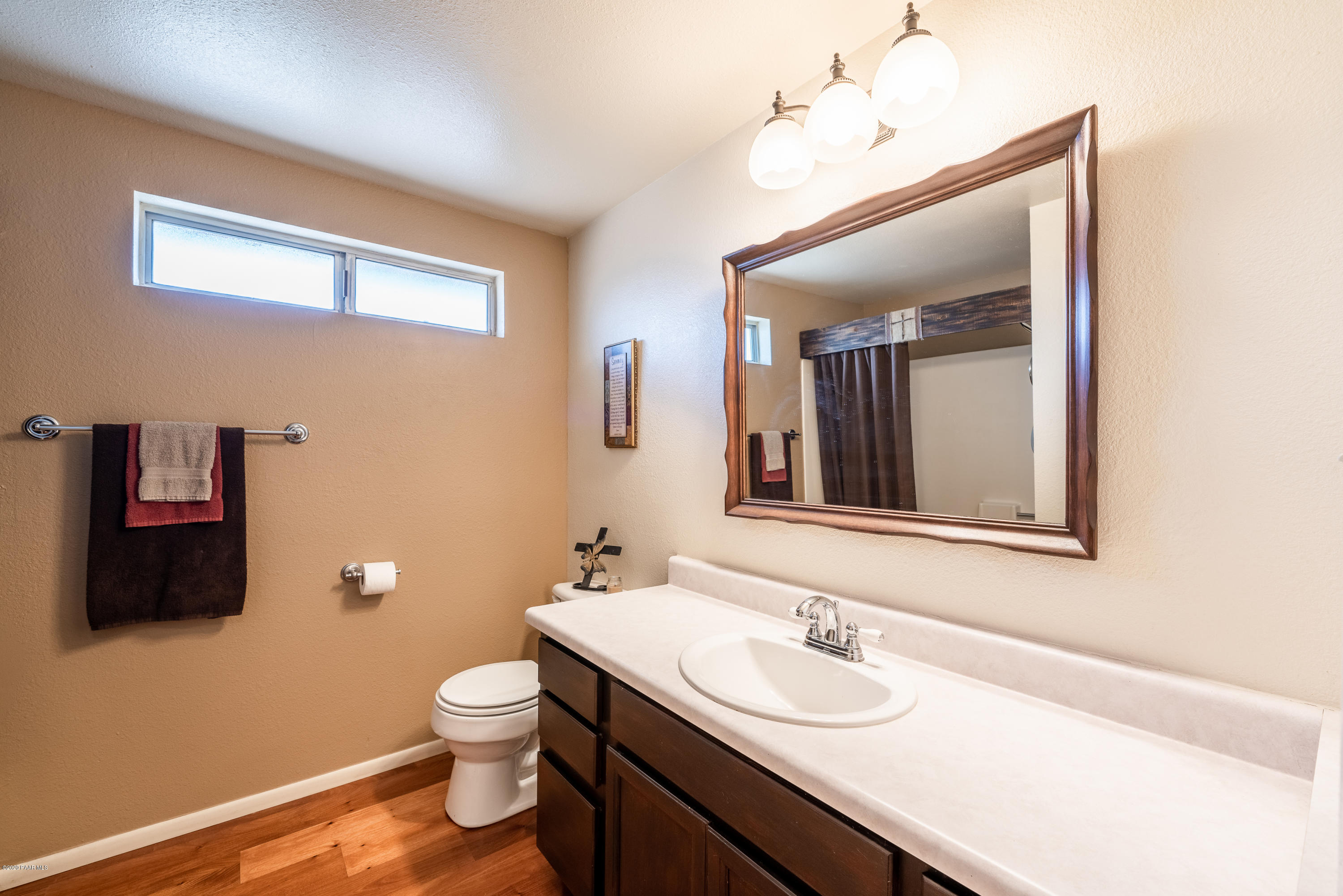 700 Ranch House Road Paulden, AZ 86334 - Photo 20 of 26 a bathroom with a toilet a sink and mirror