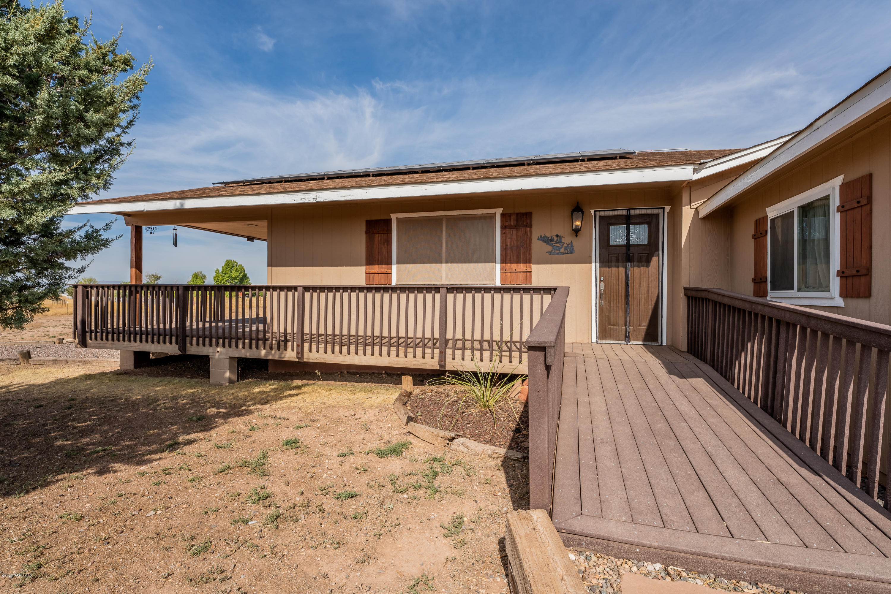 700 Ranch House Road Paulden, AZ 86334 - Photo 2 of 26 a view of a house with wooden floor roof and chair