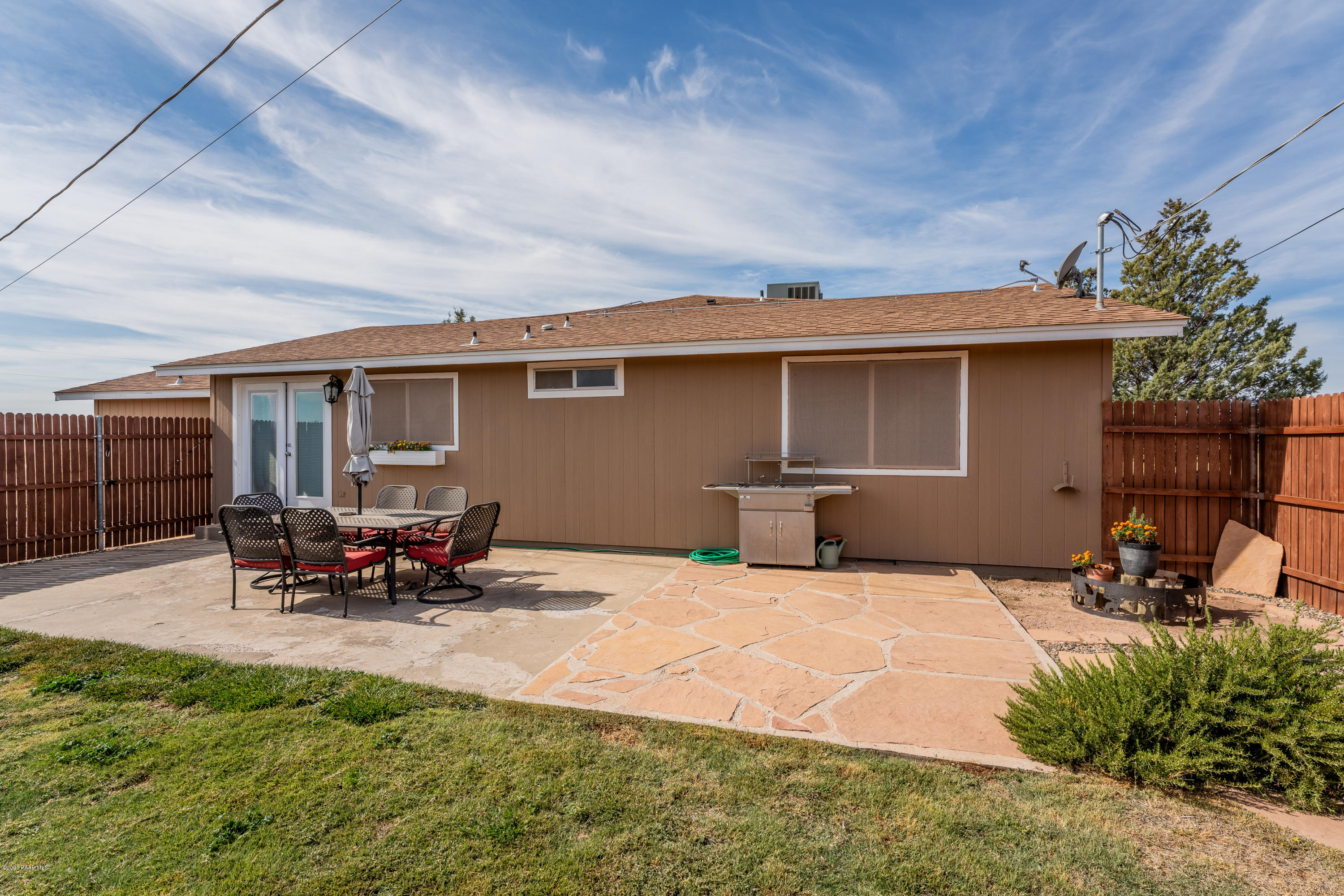 700 Ranch House Road Paulden, AZ 86334 - Photo 22 of 26 a view of a backyard with a sitting area and furniture