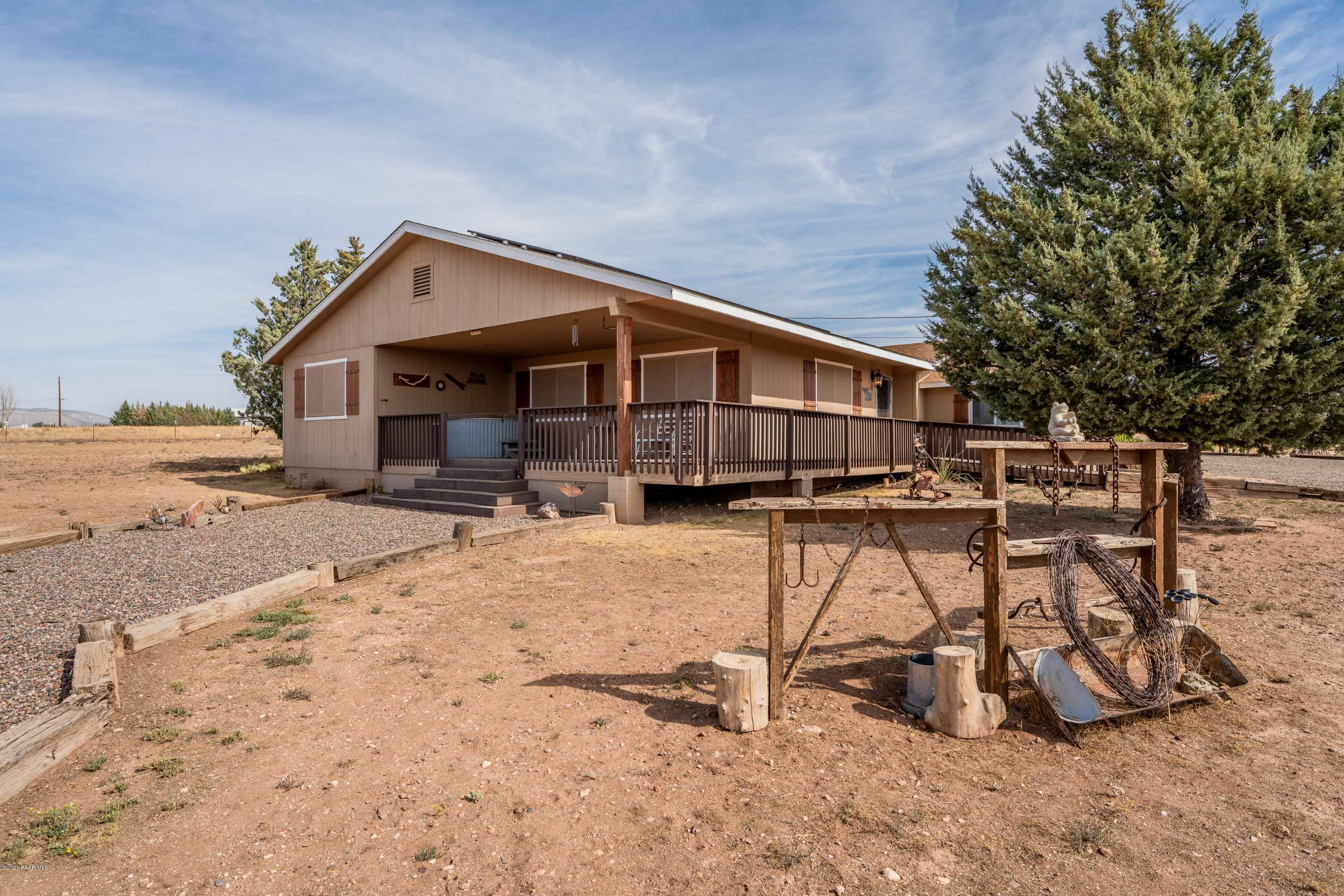 700 Ranch House Road Paulden, AZ 86334 - Photo 7 of 26 a view of a terrace with chairs and wooden fence