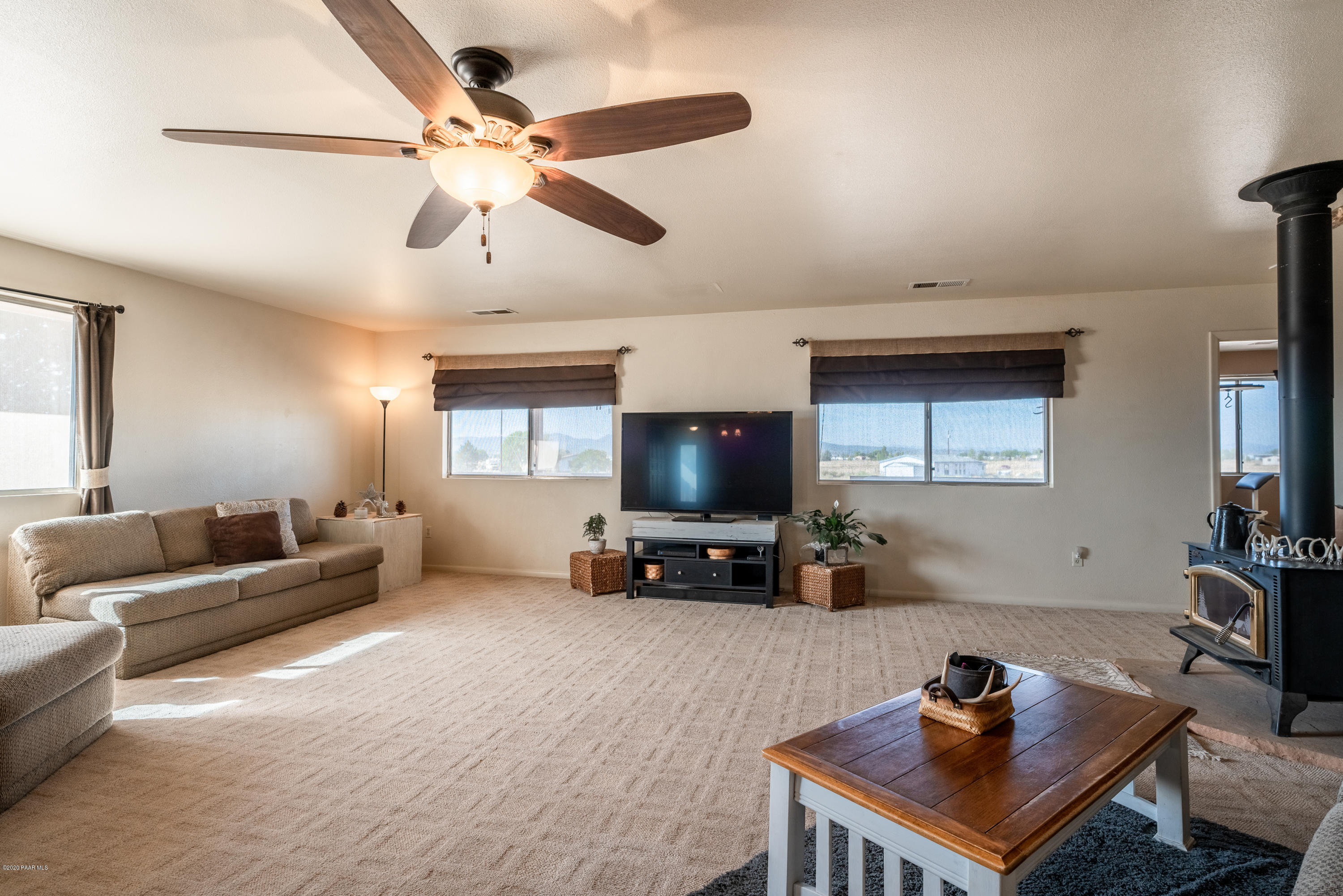 700 Ranch House Road Paulden, AZ 86334 - Photo 8 of 26 a living room with furniture and a flat screen tv