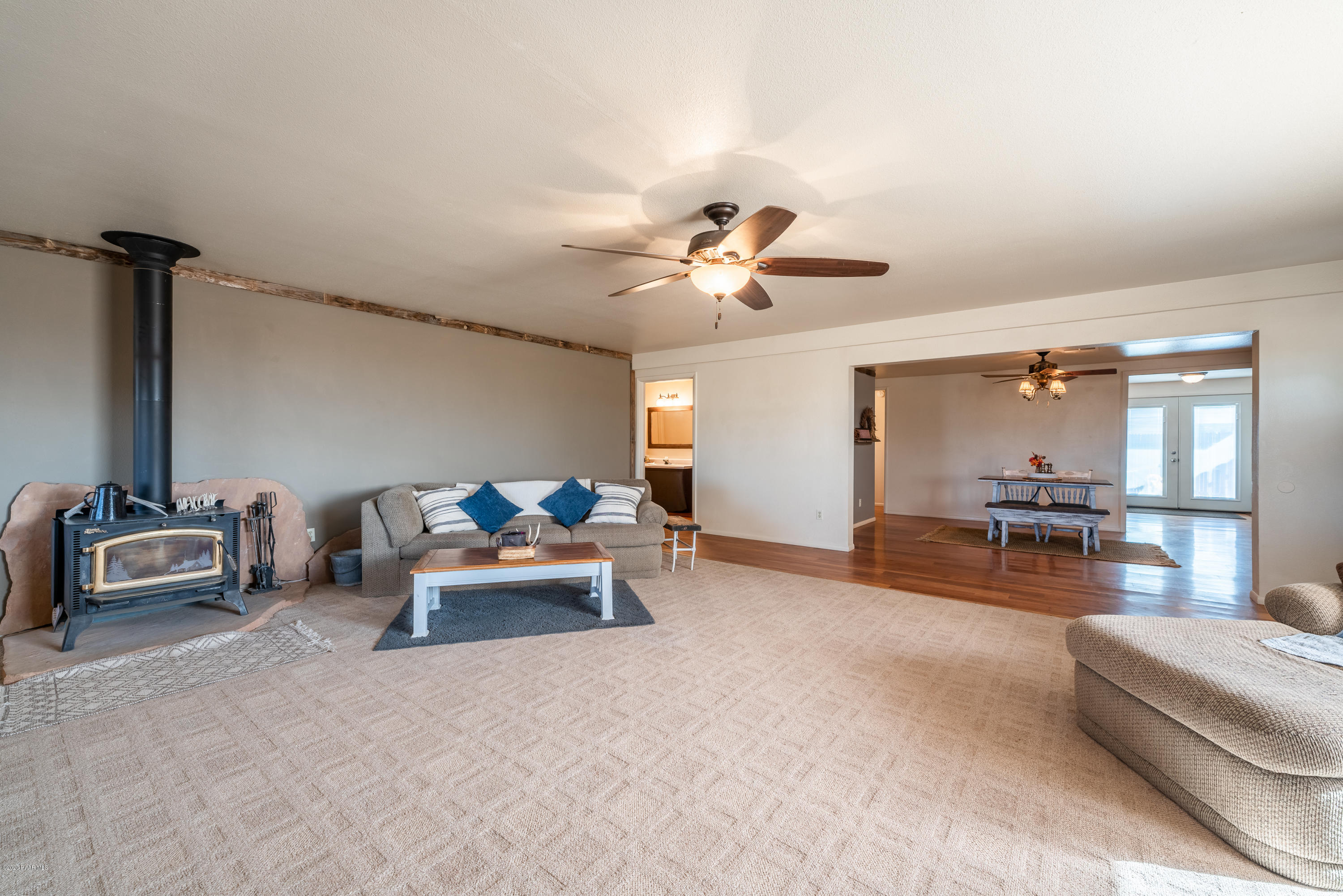 700 Ranch House Road Paulden, AZ 86334 - Photo 9 of 26 a living room with furniture and a chandelier