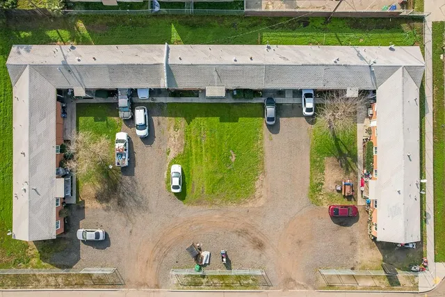 an aerial view of a house with a swimming pool
