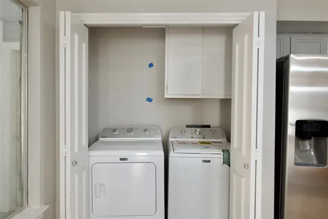 a view of a room with wooden floor and a bathroom