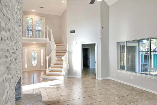 a kitchen with granite countertop a refrigerator and a sink