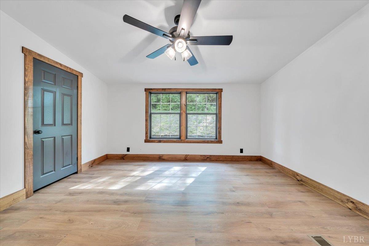 2781 Johnson School Road Thaxton, VA 24174 - Photo 36 of 63 an empty room with windows and fan