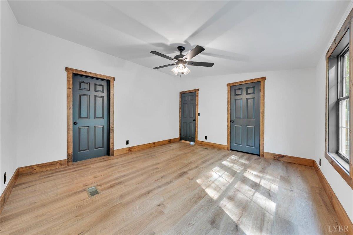 2781 Johnson School Road Thaxton, VA 24174 - Photo 37 of 63 a view of a big room with closet and a chandelier fan